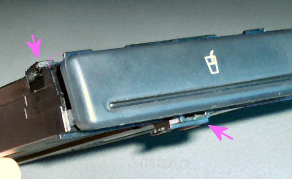 securing tabs on the Audi A4 cup holder module.